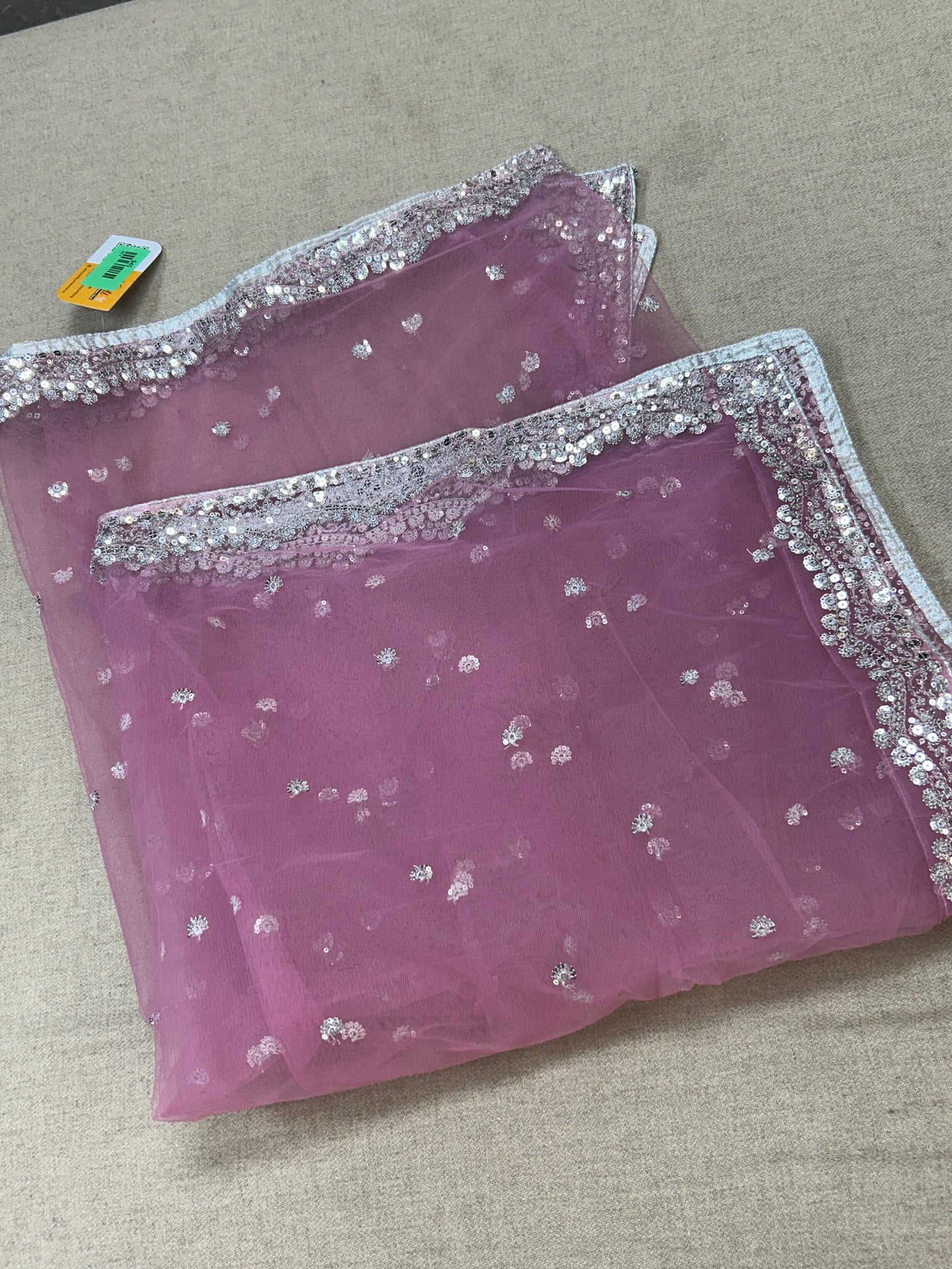 Light pink net dupatta with silver sequin border