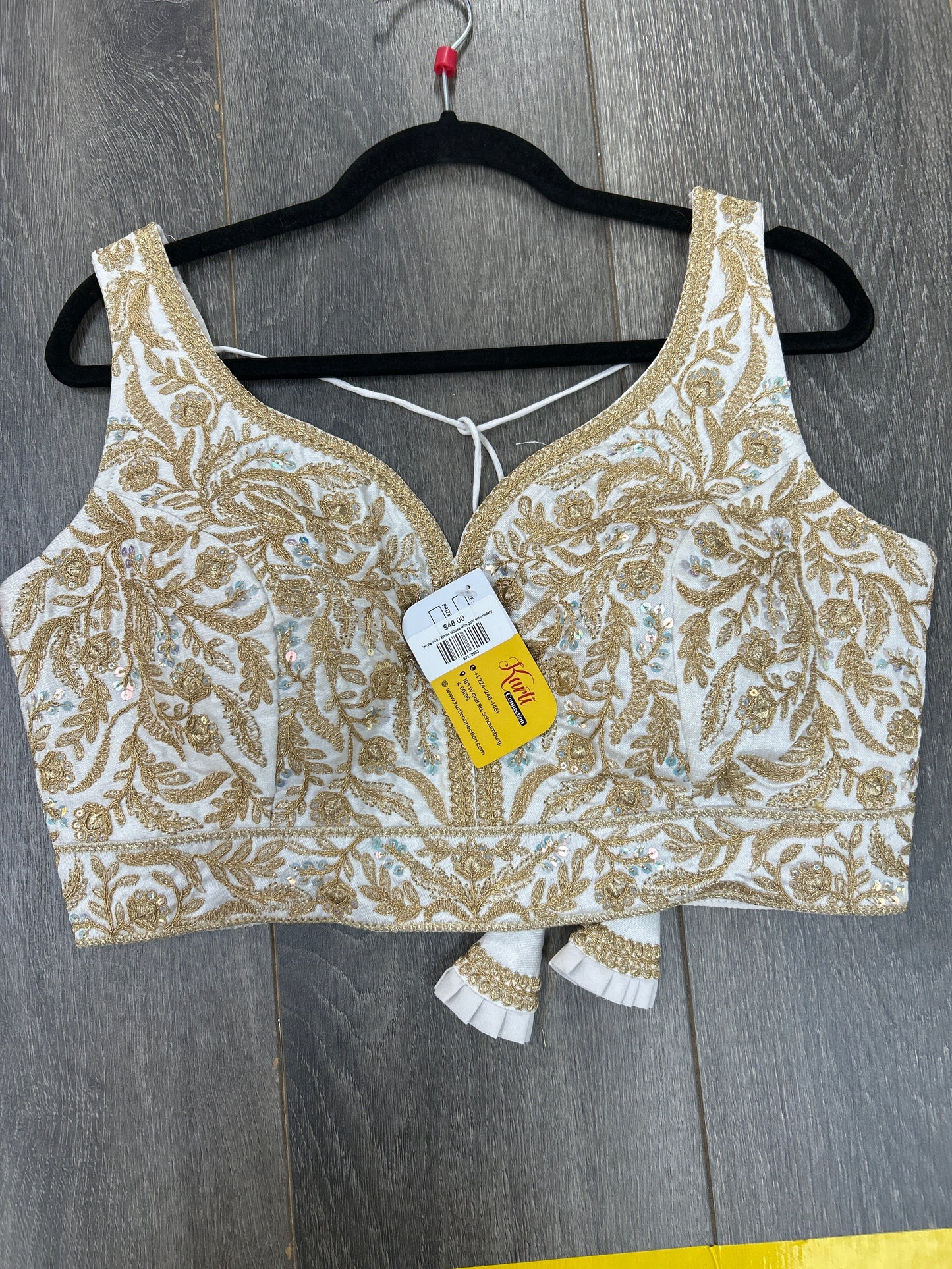 White blouse with gold embroidery