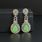 Green carved stone earrings